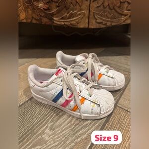 Adidas Kids Sneakers with White, Blue, and Orange Stripes